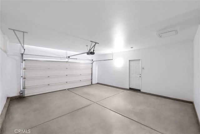 27132 Golden Field Ct, Moreno Valley, CA 92555 - garage featuring baseboards and a garage door opener