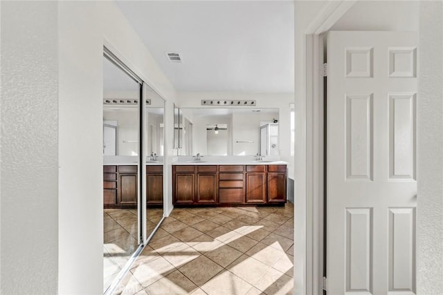 27132 Golden Field Ct, Moreno Valley, CA 92555 - full bathroom featuring double vanity and tile patterned flooring