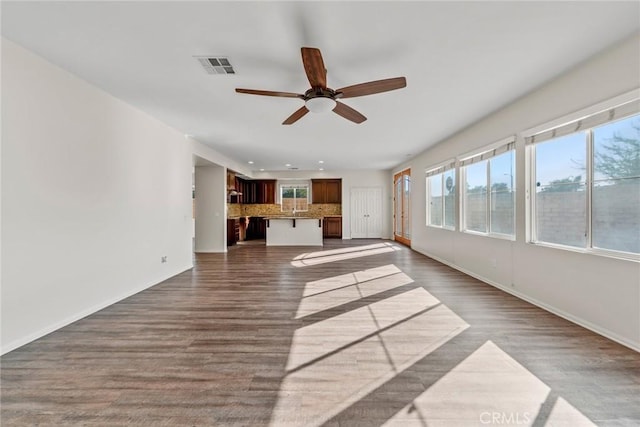 27132 Golden Field Ct, Moreno Valley, CA 92555 - unfurnished living room featuring ceiling fan, dark wood finished floors, and recessed lighting