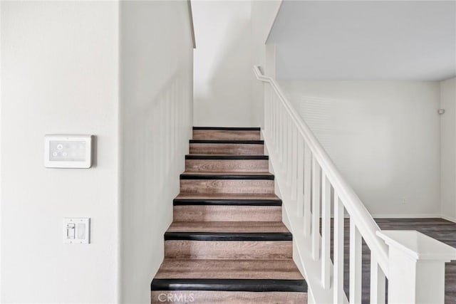 27132 Golden Field Ct, Moreno Valley, CA 92555 - staircase with wood finished floors and baseboards