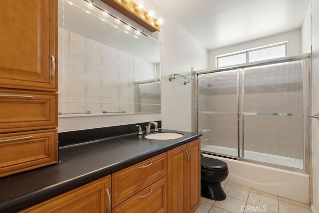 207 N Pasadena Ave, Azusa, CA 91702 - full bathroom featuring vanity, shower / bath combination with glass door, and tile patterned flooring