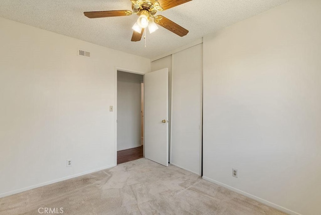 207 N Pasadena Ave, Azusa, CA 91702 - unfurnished room featuring light carpet, a textured ceiling, and ceiling fan
