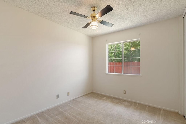 207 N Pasadena Ave, Azusa, CA 91702 - empty room with a textured ceiling, light colored carpet, and ceiling fan