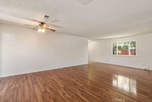 207 N Pasadena Ave, Azusa, CA 91702 - empty room featuring wood finished floors, ceiling fan, and a textured ceiling