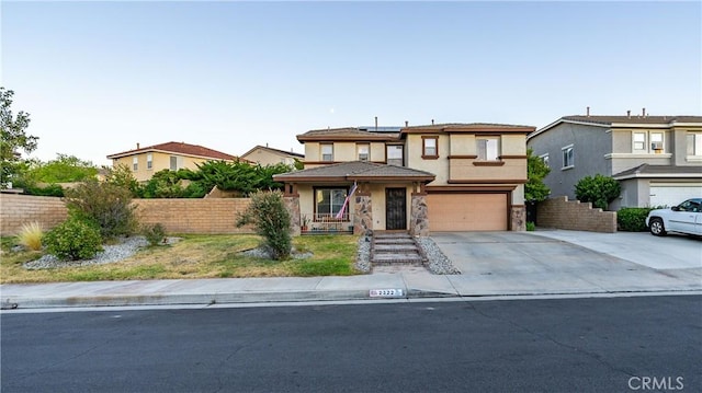2322 Carolyn Dr, Palmdale, CA 93551 - traditional home with stucco siding, roof mounted solar panels, concrete driveway, a garage, and a residential view