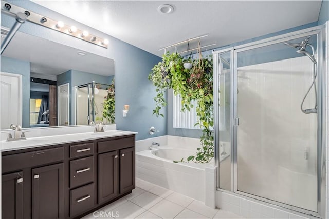 2322 Carolyn Dr, Palmdale, CA 93551 - full bathroom featuring double vanity, a shower stall, a garden tub, and tile patterned floors