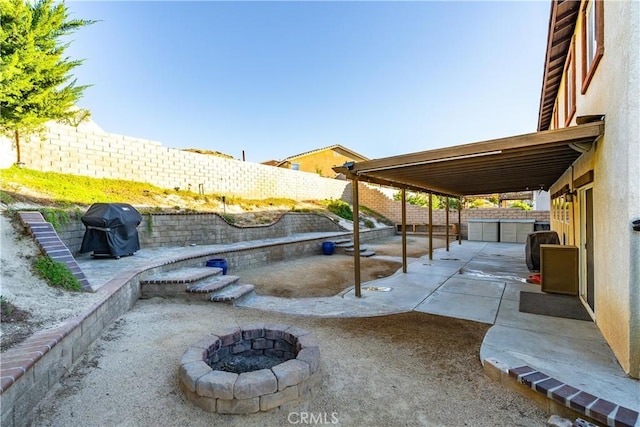 2322 Carolyn Dr, Palmdale, CA 93551 - fenced backyard with a grill, an outdoor fire pit, an outbuilding, and a patio