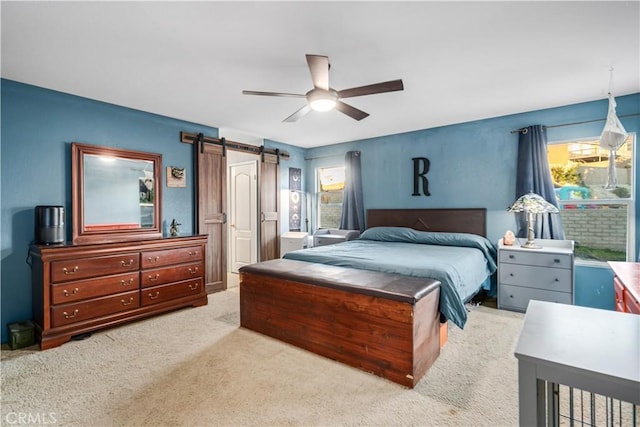 2322 Carolyn Dr, Palmdale, CA 93551 - bedroom featuring a barn door, carpet floors, and ceiling fan