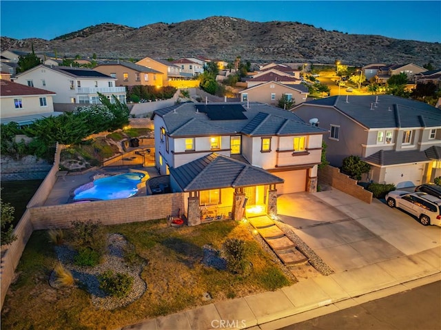 2322 Carolyn Dr, Palmdale, CA 93551 - view of front facade featuring an attached garage, a residential view, a mountain view, solar panels, and concrete driveway