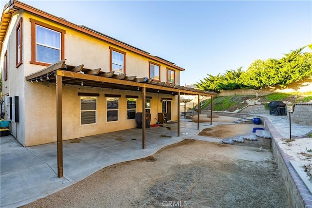 2322 Carolyn Dr, Palmdale, CA 93551 - rear view of property with stucco siding and a patio area