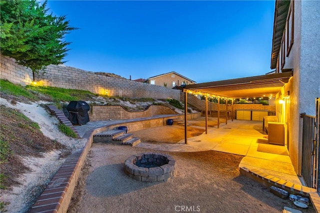 2322 Carolyn Dr, Palmdale, CA 93551 - fenced backyard featuring a fire pit and a patio area