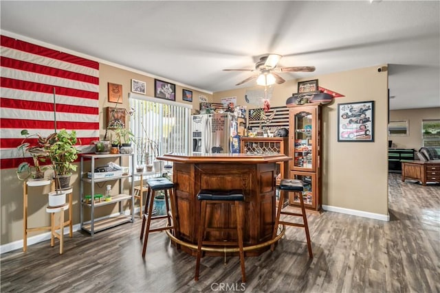 2322 Carolyn Dr, Palmdale, CA 93551 - indoor dry bar with ceiling fan, plenty of natural light, and wood finished floors