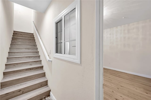 3470 E Temple Way, West Covina, CA 91791 - stairway featuring wood finished floors and baseboards
