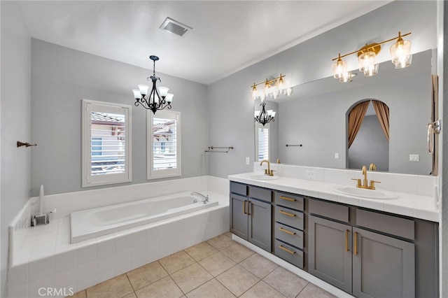 3470 E Temple Way, West Covina, CA 91791 - full bathroom featuring a chandelier, double vanity, a garden tub, and tile patterned floors