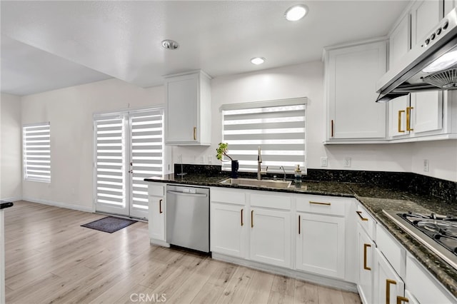 3470 E Temple Way, West Covina, CA 91791 - kitchen featuring appliances with stainless steel finishes, under cabinet range hood, white cabinetry, light wood finished floors, and dark stone counters