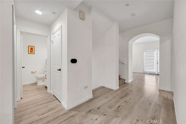 3470 E Temple Way, West Covina, CA 91791 - hall featuring arched walkways, light wood-type flooring, and stairway