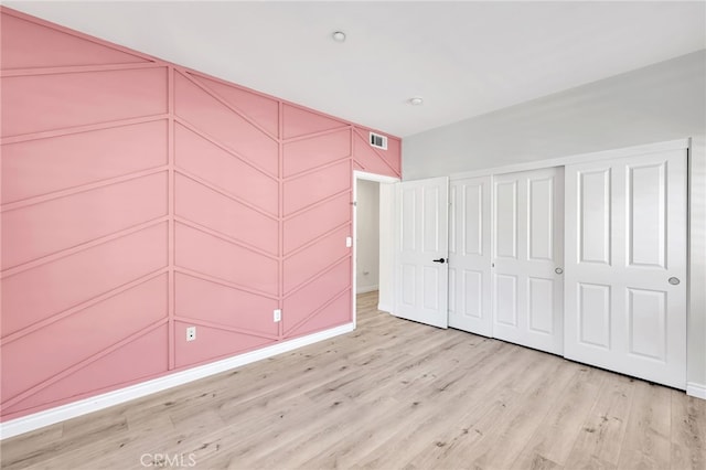 3470 E Temple Way, West Covina, CA 91791 - unfurnished bedroom featuring wood finished floors and a closet