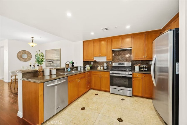 68 E Bay State St Unit 3F, Alhambra, CA 91801 - kitchen featuring stainless steel appliances, a peninsula, brown cabinetry, backsplash, and recessed lighting