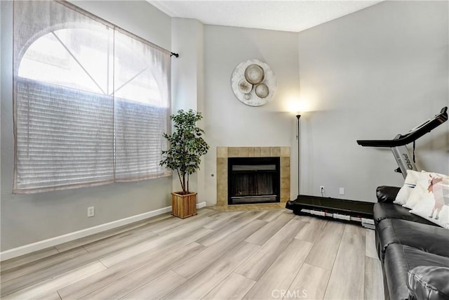 2620 W Grand Ave Unit E, Alhambra, CA 91801 - living area featuring wood finished floors and a tile fireplace