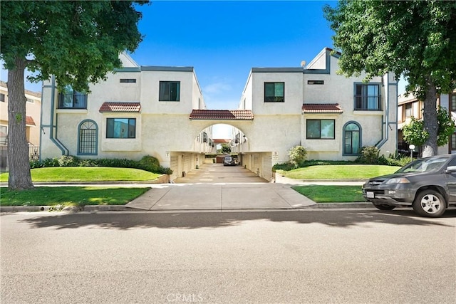 2620 W Grand Ave Unit E, Alhambra, CA 91801 - view of front of property featuring stucco siding and a front yard