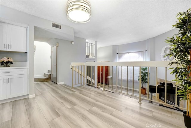 2620 W Grand Ave Unit E, Alhambra, CA 91801 - living room with a textured ceiling and light wood-type flooring