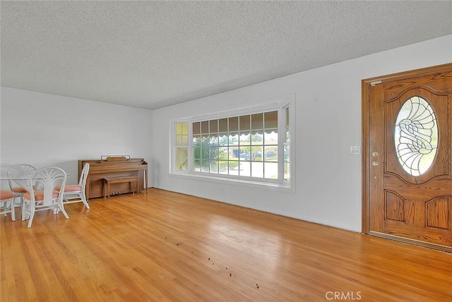 902 W Lucille Ave, West Covina, CA 91790 - entrance foyer featuring wood finished floors and a textured ceiling