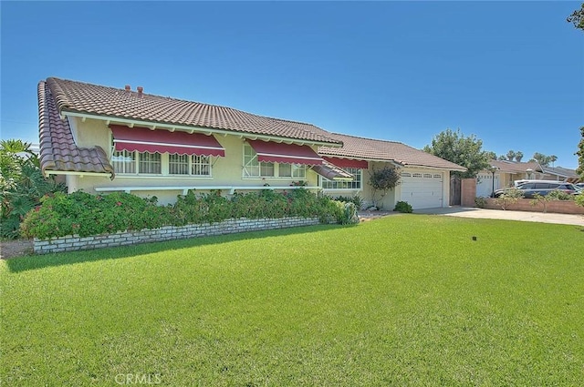 902 W Lucille Ave, West Covina, CA 91790 - view of front facade featuring a tiled roof, a front lawn, a garage, concrete driveway, and stucco siding