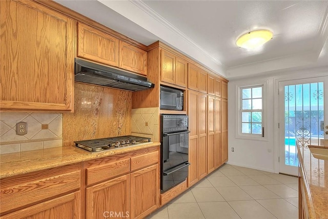 902 W Lucille Ave, West Covina, CA 91790 - kitchen with black appliances, a warming drawer, range hood, decorative backsplash, and light tile patterned floors