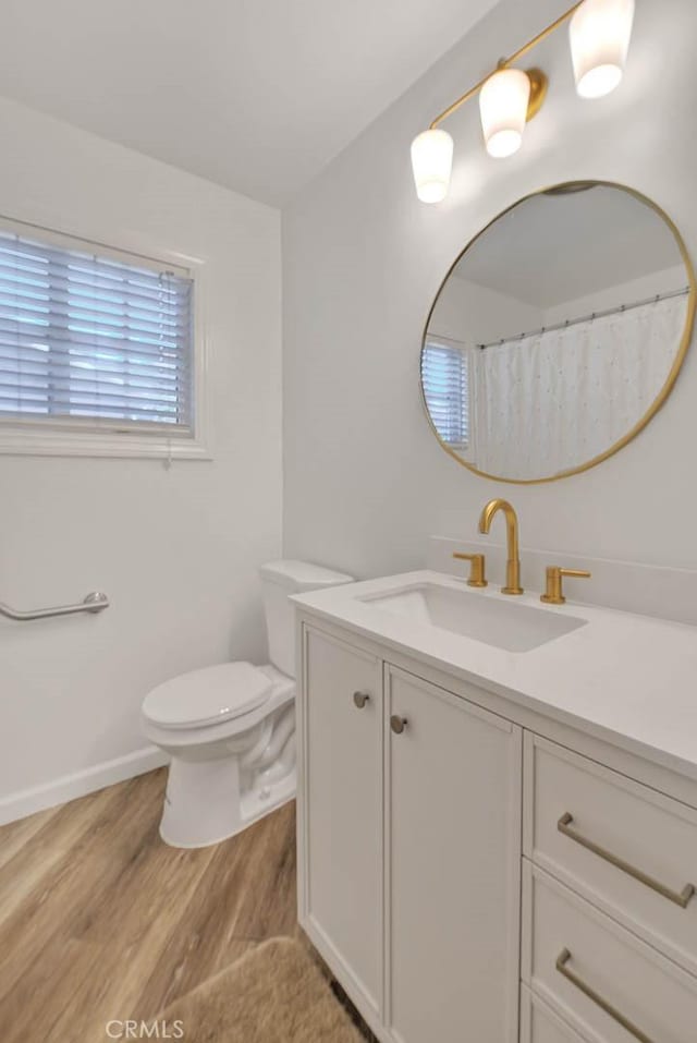 902 W Lucille Ave, West Covina, CA 91790 - full bathroom featuring vanity and wood finished floors