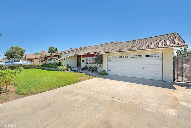 902 W Lucille Ave, West Covina, CA 91790 - view of front of house with a tiled roof, concrete driveway, stucco siding, an attached garage, and a front lawn