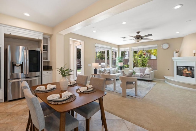 3463 Corte Fresa, Carlsbad, CA 92009 - dining area featuring light carpet, recessed lighting, a ceiling fan, a fireplace, and light tile patterned floors