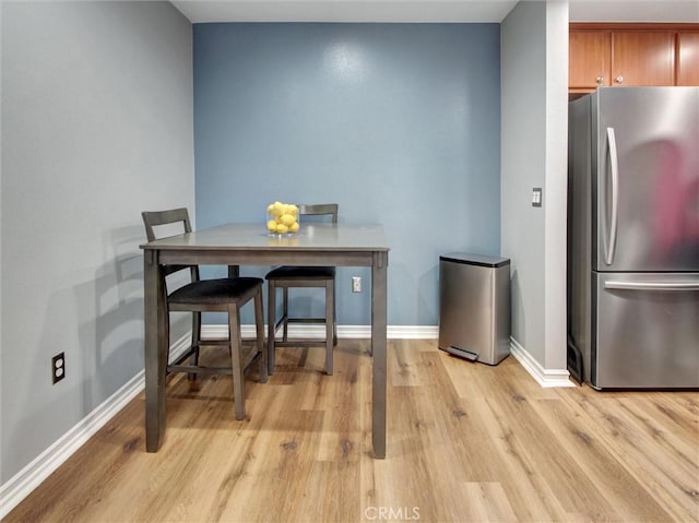 3010 Associated Rd Unit 133, Fullerton, CA 92835 - dining room featuring light wood finished floors and baseboards