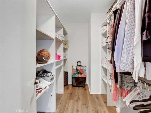 3010 Associated Rd Unit 133, Fullerton, CA 92835 - spacious closet with wood finished floors