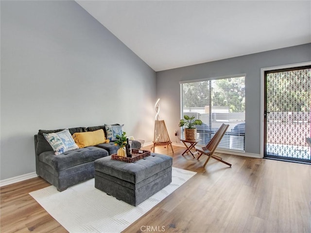3010 Associated Rd Unit 133, Fullerton, CA 92835 - living room with lofted ceiling and wood finished floors