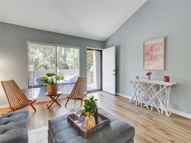 3010 Associated Rd Unit 133, Fullerton, CA 92835 - living room with lofted ceiling and light wood-style flooring