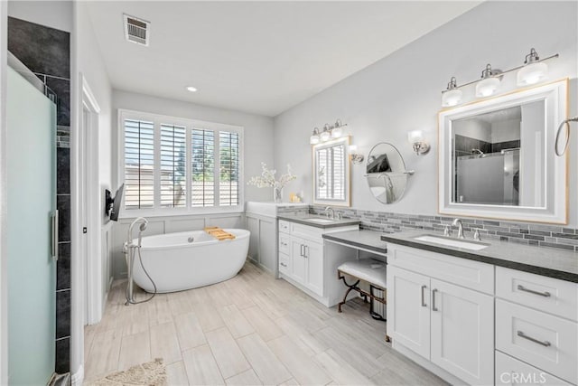 7133 Brisas Ct, Rancho Cucamonga, CA 91739 - bathroom with vanity, a freestanding bath, a shower stall, and wainscoting