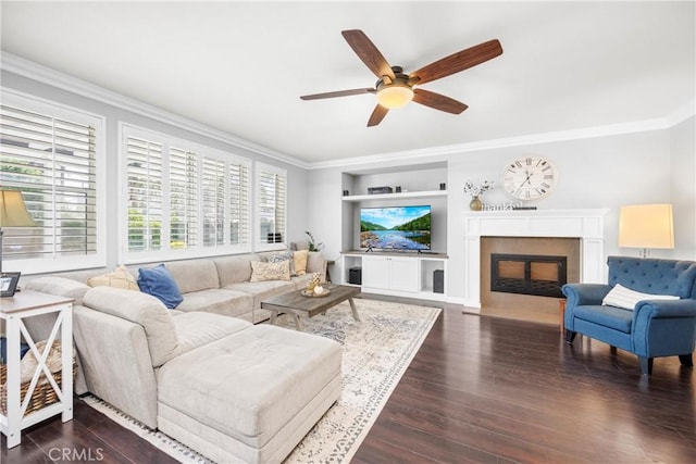 7133 Brisas Ct, Rancho Cucamonga, CA 91739 - living room with ornamental molding, ceiling fan, dark wood-style flooring, a fireplace, and built in features