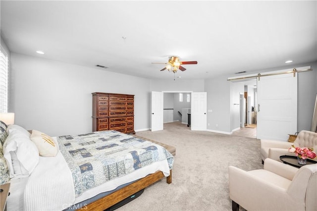 7133 Brisas Ct, Rancho Cucamonga, CA 91739 - bedroom with a barn door, light colored carpet, recessed lighting, and a ceiling fan