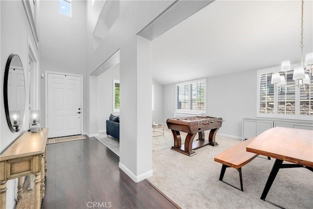 7133 Brisas Ct, Rancho Cucamonga, CA 91739 - entrance foyer with dark wood finished floors, a chandelier, and a high ceiling
