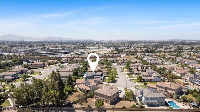 7133 Brisas Ct, Rancho Cucamonga, CA 91739 - aerial perspective of suburban area with a mountainous background and a pool area