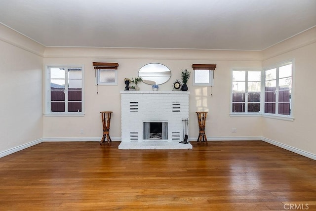 1417 Highland Ave, Needles, CA 92363 - unfurnished living room featuring wood finished floors and a fireplace
