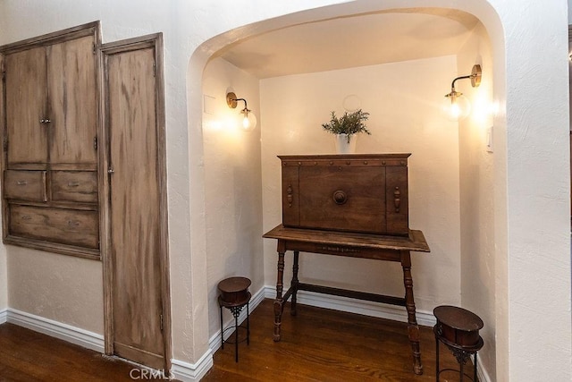 1417 Highland Ave, Needles, CA 92363 - corridor featuring arched walkways and wood finished floors