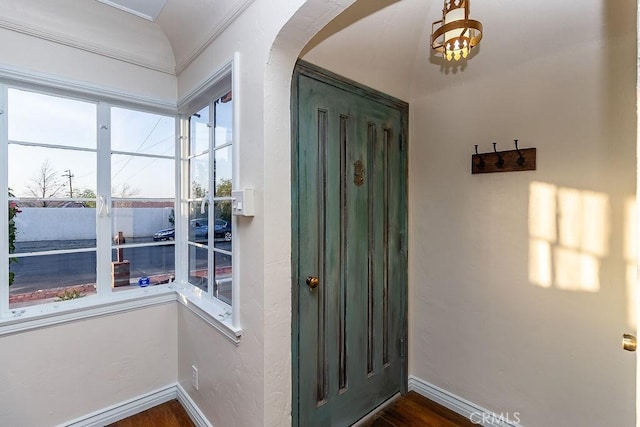 1417 Highland Ave, Needles, CA 92363 - foyer entrance with arched walkways and dark wood-style floors