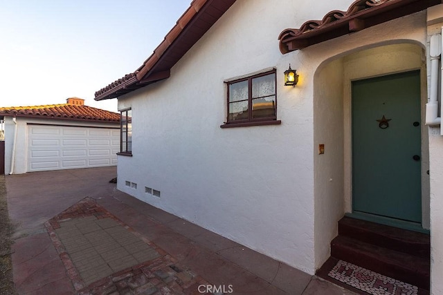 1417 Highland Ave, Needles, CA 92363 - entrance to property featuring stucco siding and a garage