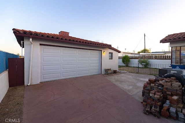1417 Highland Ave, Needles, CA 92363 - garage at dusk with a garage