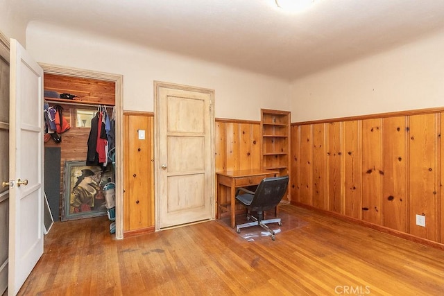 1417 Highland Ave, Needles, CA 92363 - office featuring wood finished floors, a wainscoted wall, and wood walls