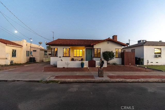 1417 Highland Ave, Needles, CA 92363 - mediterranean / spanish-style home with a tiled roof, stucco siding, and a chimney