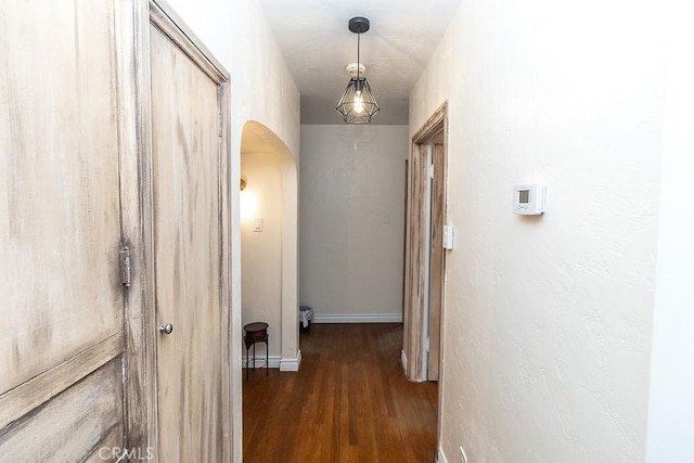 1417 Highland Ave, Needles, CA 92363 - hallway with arched walkways and wood finished floors