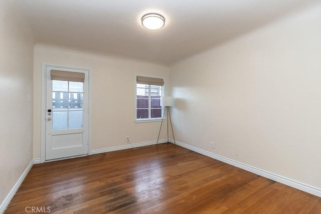 1417 Highland Ave, Needles, CA 92363 - spare room featuring dark wood finished floors