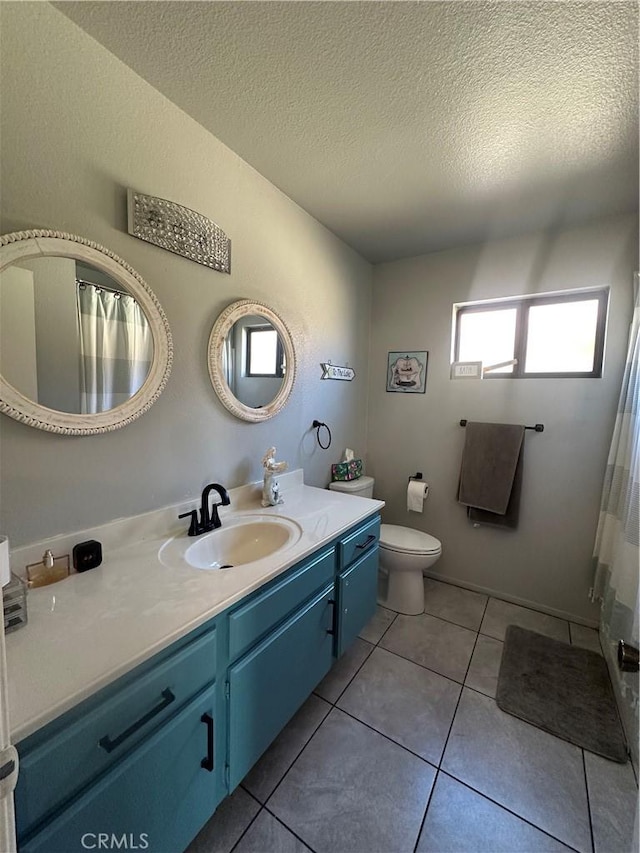 813 Cortez Dr, Hemet, CA 92545 - bathroom featuring vanity, a textured ceiling, tile patterned floors, and a shower with shower curtain